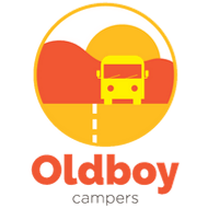 A circular logo featuring a stylized yellow camper van on an orange and yellow road, set against a backdrop of mountainous scenery in warm hues of orange and yellow. Below, the text "Oldboy campers" is written in bold, orange letters.