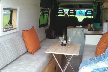 A table and chairs in a van.