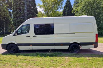 the full side angle of the van parked on the street