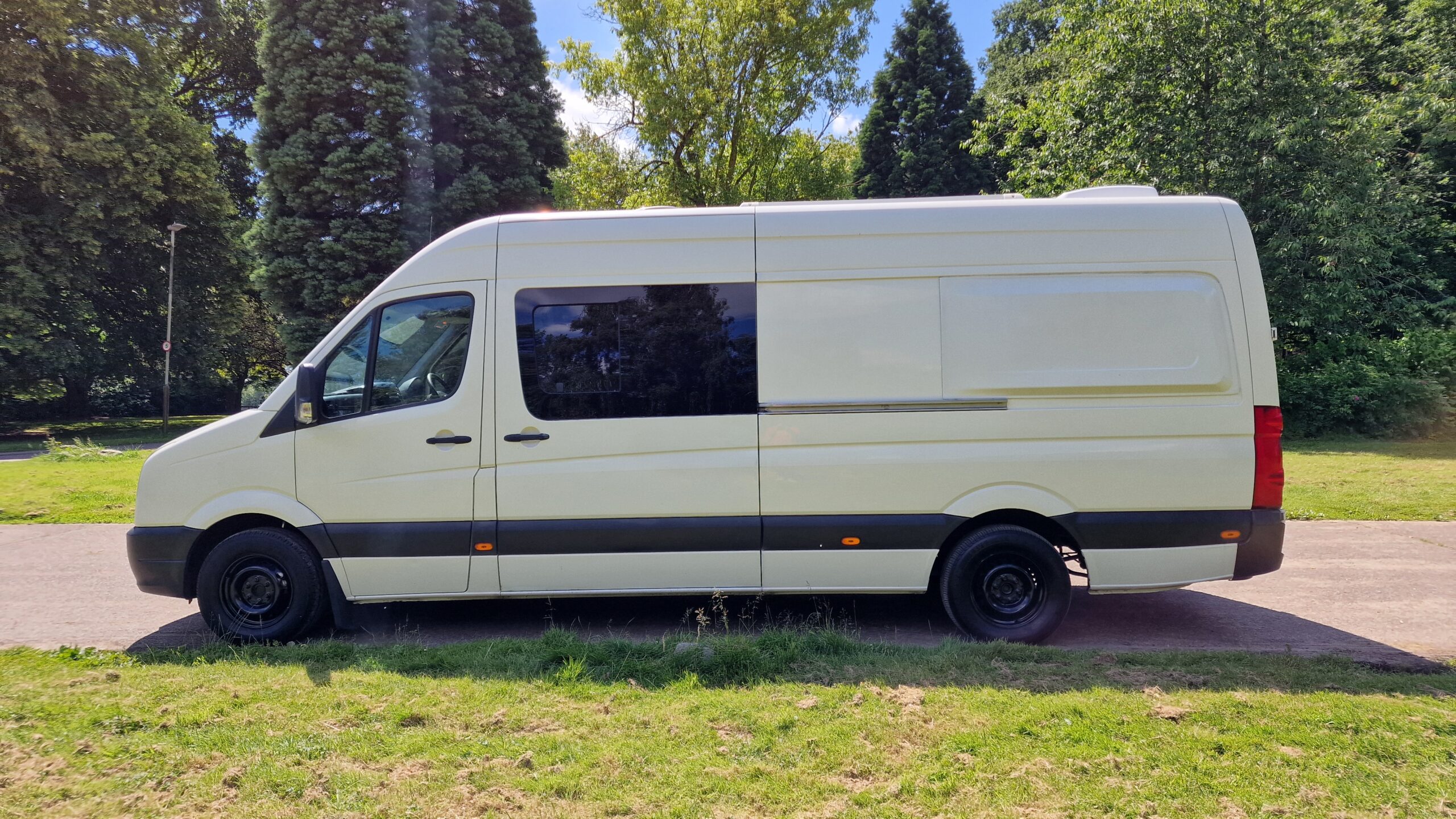 the full side angle of the van parked on the street