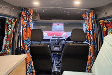 2015 VW Caddy Maxi Micro-camper inside driver seats and curtains