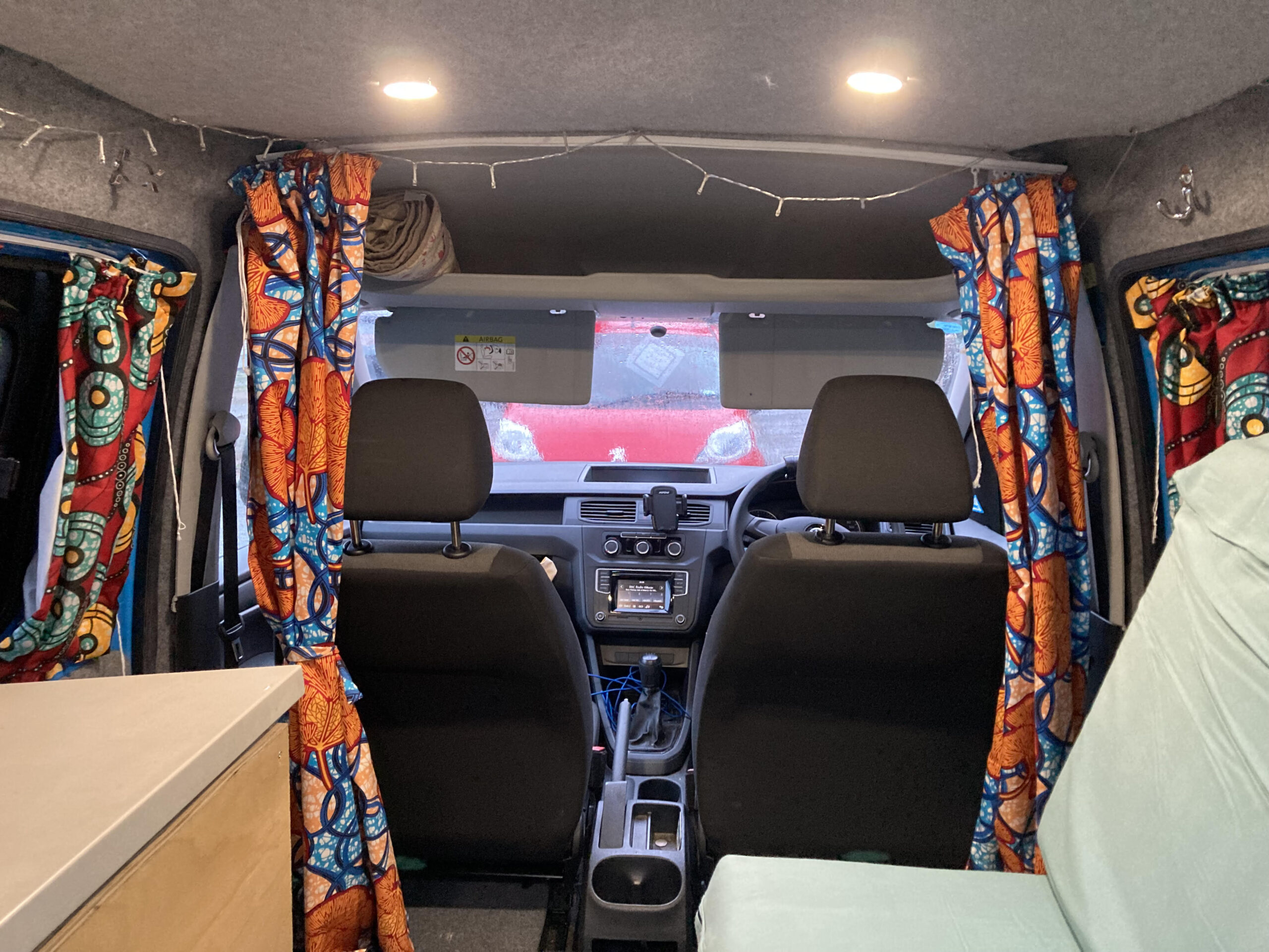 2015 VW Caddy Maxi Micro-camper inside driver seats and curtains